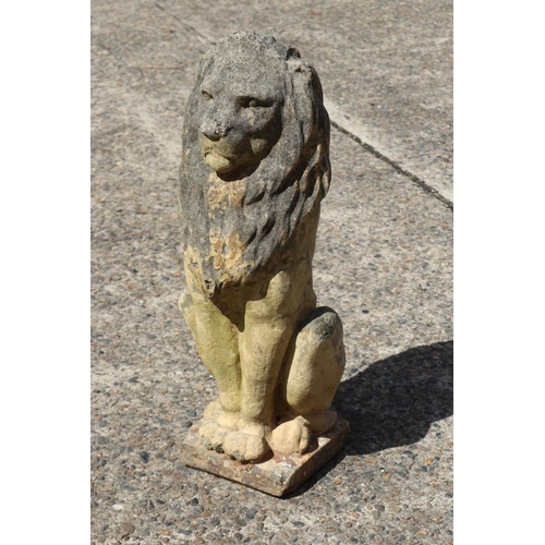 440 - Composite stone lion garden statute, approx 63cm H x 24cm W x 28cm D