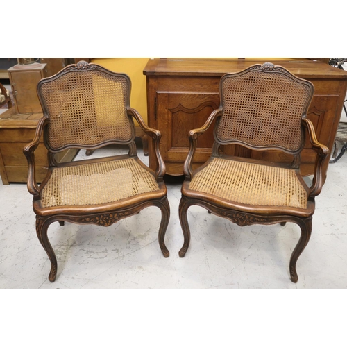1063 - Pair of antique French Louis XV style armchairs, with cane seats & backs, nice large saddle to each,... 
