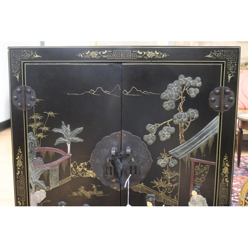 1134 - Chinese black lacquer two door side cabinet, decorated with hardstone scene, approx 62cm L x 31cm W ... 