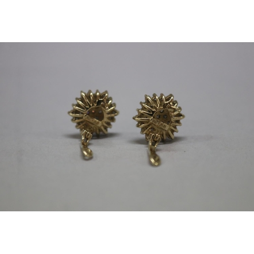 1123 - Pair of diamond cluster earrings, set in 9ct gold, pierced huggie style backs