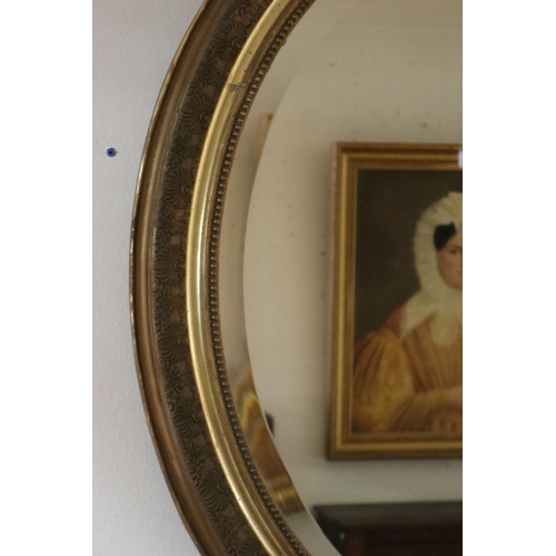 1064 - Antique French Louis XV style gilt framed oval wall mirror with C scroll crest to top, approx 122cm ... 