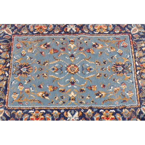 1110 - Hand woven blue ground carpet, approx 85cm x 59cm
