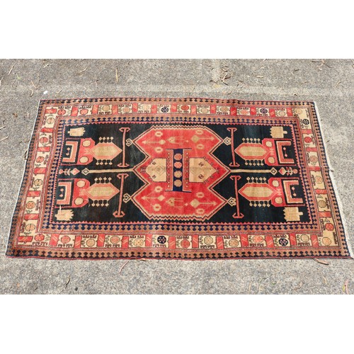 1138 - Handwoven carpet of red and black ground, Geometric design, approx 146cm x 257cm