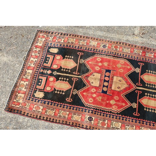 1138 - Handwoven carpet of red and black ground, Geometric design, approx 146cm x 257cm