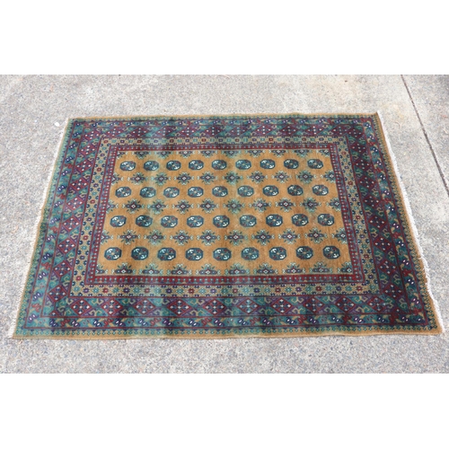 1147 - Handwoven red and brown ground carpet, approx 166cm x 238cm