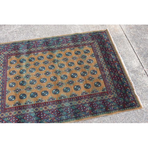 1147 - Handwoven red and brown ground carpet, approx 166cm x 238cm