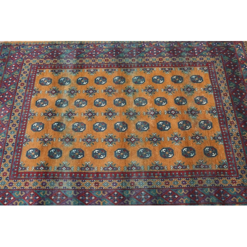 1147 - Handwoven red and brown ground carpet, approx 166cm x 238cm