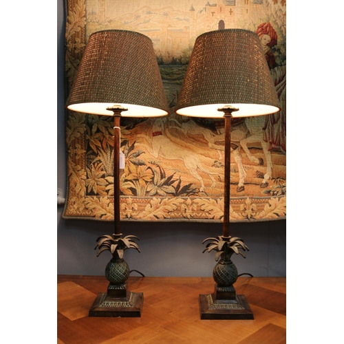 1118 - Pair of brass pineapple based column lamps, with woven fiber shades to match, in working condition a... 