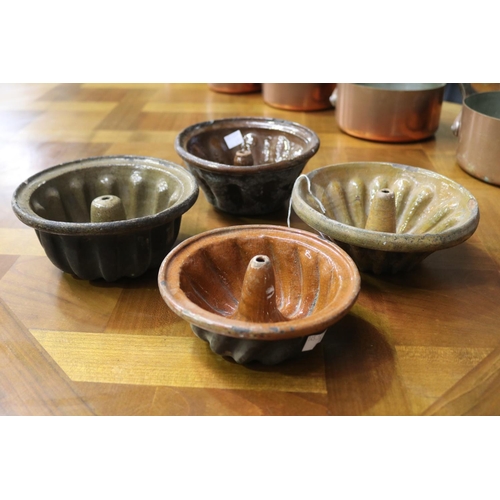 1130 - Four antique glazed pottery French bundt moulds, approx 9cm H x 19cm Dia and smaller (4)