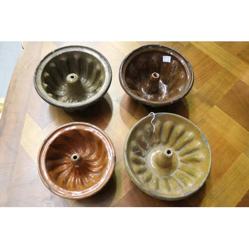 1130 - Four antique glazed pottery French bundt moulds, approx 9cm H x 19cm Dia and smaller (4)