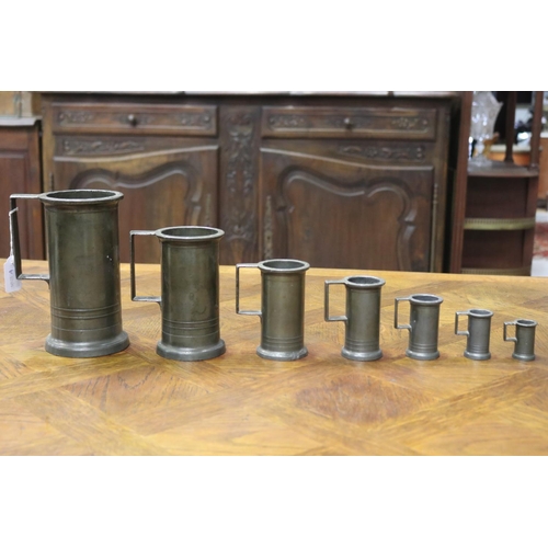 1148 - Good heavy set of seven antique French pewter graduating measures, largest 1 litre, approx 19cm H x ... 