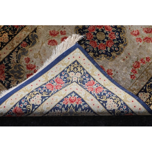 175 - Persian silk carpet with a design of stylised flower heads, approx 118cm x 77cm