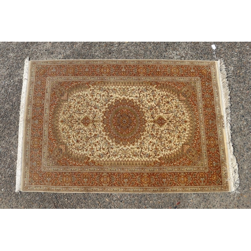 187 - Silk Qum carpet with central medallion on ivory field, inscribed to one end, approx 147cm x 99cm