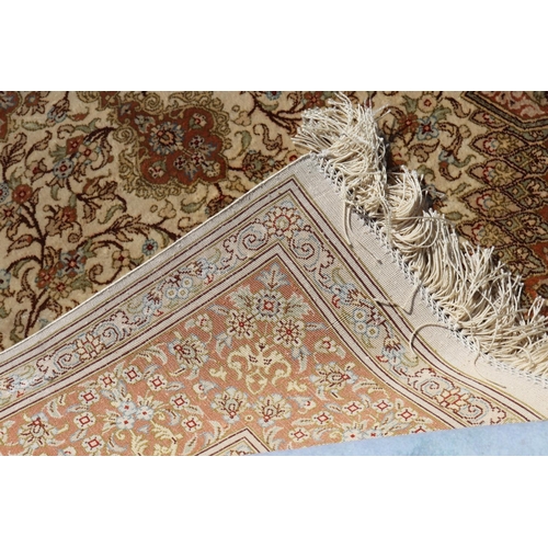 187 - Silk Qum carpet with central medallion on ivory field, inscribed to one end, approx 147cm x 99cm