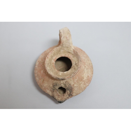 7 - Ancient terracotta oil lamp, approx 6cm H x 10cm W