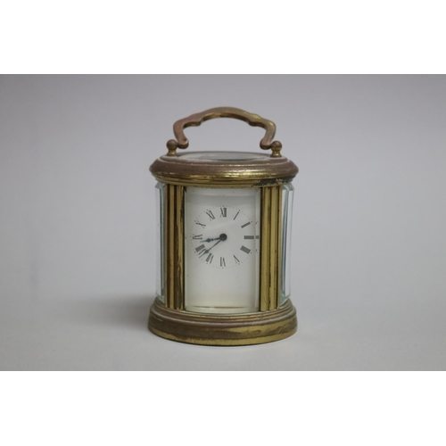 8 - Miniature French brass oval carriage clock, with key, untested / unknown working condition, approx 8... 