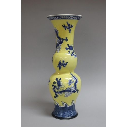 48 - Wedgwood double gourd vase decorated in blue and yellow with dragons and clouds, impressed mark to b... 