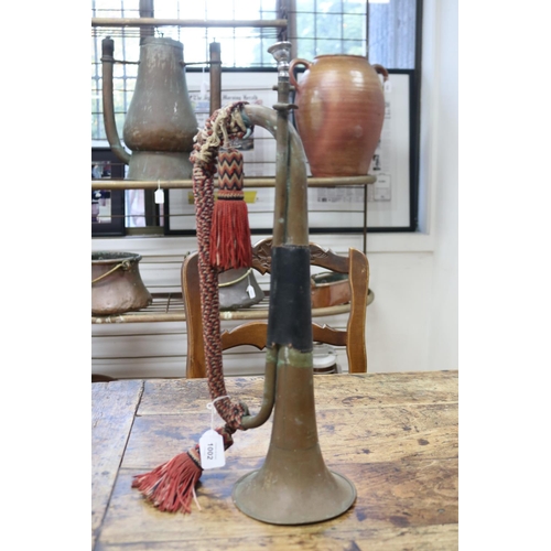 1002 - Antique French brass bugle, original tassel handle grip, approx 50cm H x 15cm L x 14cm Dia