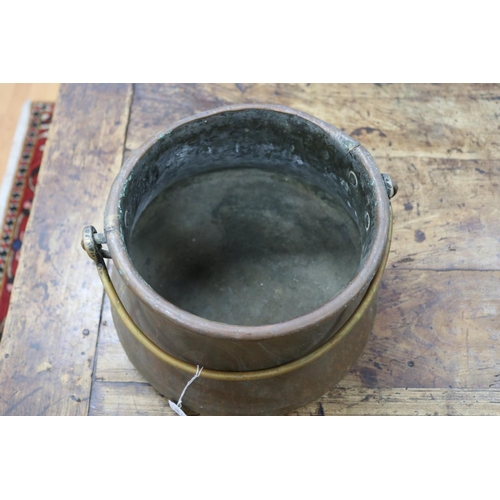 1012 - Antique swing handled copper pot, approx 22cm H x 32cm Dia