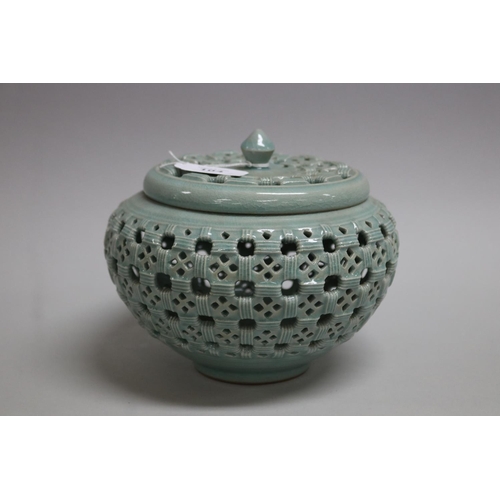 104 - Korean Goryeo style celadon reticulated lidded vase, signed to base, approx 18cm H