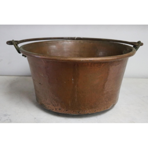 1057 - Large antique French copper and wrought iron swing handled pot, approx 20cm H x 38cm Dia (excluding ... 