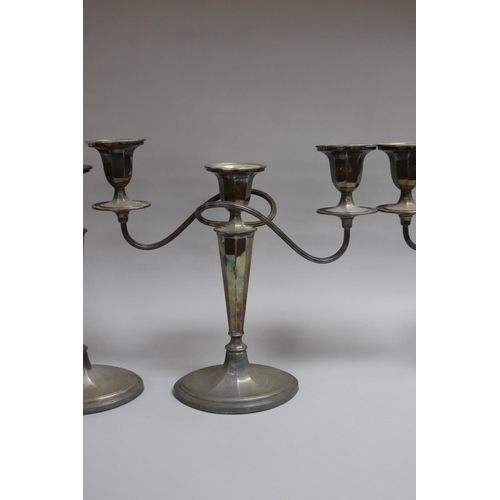 110 - Suite of Georgian style Whitehill silver, comprising of a pair of three light candelabrum and a pair... 