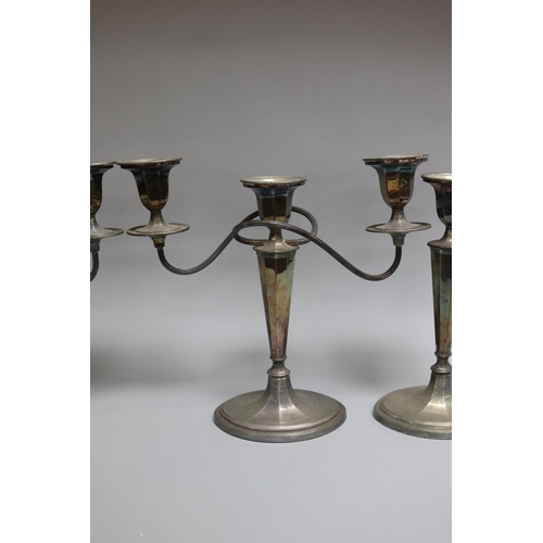 110 - Suite of Georgian style Whitehill silver, comprising of a pair of three light candelabrum and a pair... 