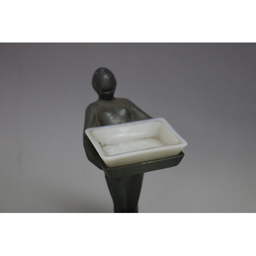 115 - Art Deco figural chromium card tray with milk glass insert, approx 24cm H