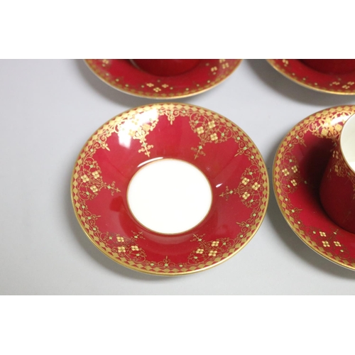 118 - Set of four crimson ground Royal Worcester coffee cans and saucers, retailed by Hardy Bros (4)