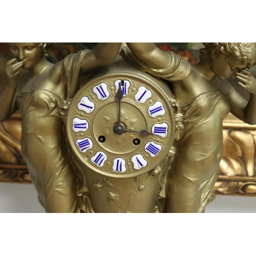 235 - French gold painted spelter mantle clock surmounted by two maidens and a putto, has key (in office D... 