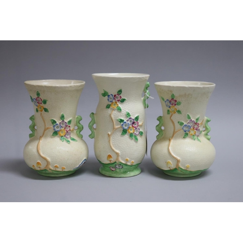 125 - Garniture of Crown Devon vases flowering trees and mushroom pattern, approx 10cm Dia x 17.5cm H (3)