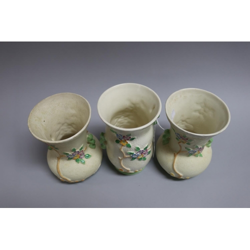 125 - Garniture of Crown Devon vases flowering trees and mushroom pattern, approx 10cm Dia x 17.5cm H (3)