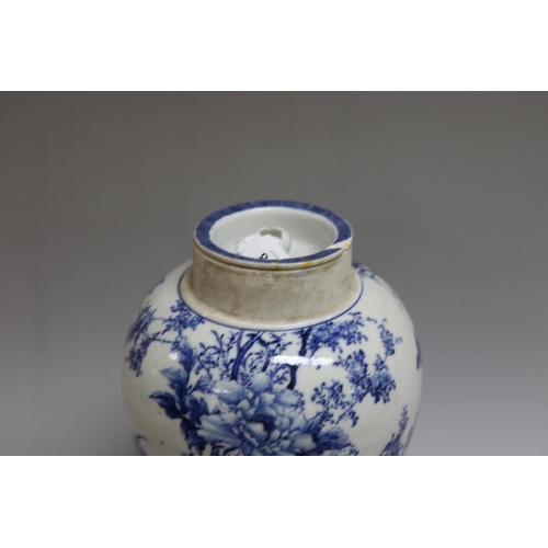 168 - Japanese porcelain covered jar decorated in blue and white birds and peonies (AF) on stand, total ap... 