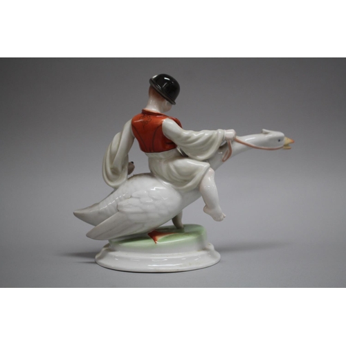1095 - Herend porcelain boy and goose, approx 21cm H x 25cm W x 12cm D