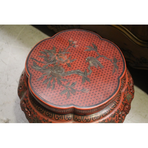 1116 - Pair of Chinese red lacquer barrel stools, with incised and painted bird and foliage decoration, pie... 