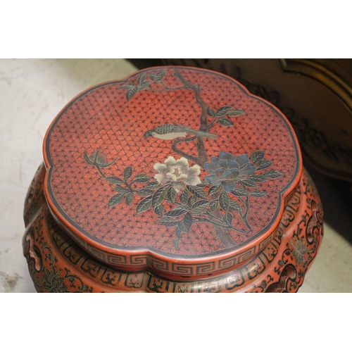 1116 - Pair of Chinese red lacquer barrel stools, with incised and painted bird and foliage decoration, pie... 