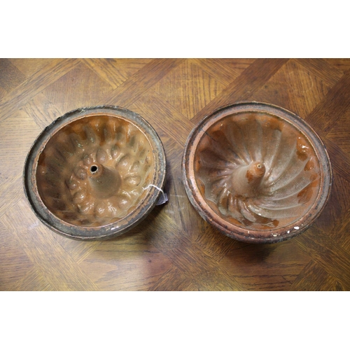 1155 - Two antique French pottery bundt moulds, approx 10cm H x 24cm Dia and smaller (2)