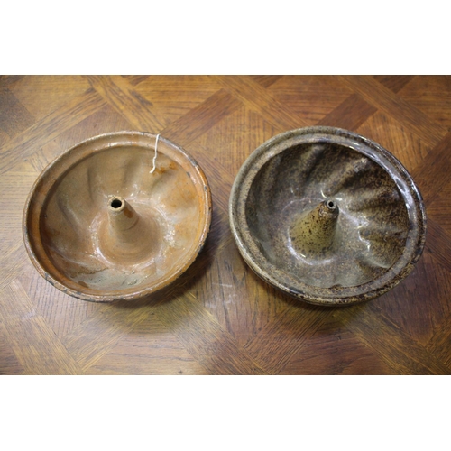 1157 - Two French antique pottery bundt moulds, apporx 10cm H x 25cm Dia and smaller (2)