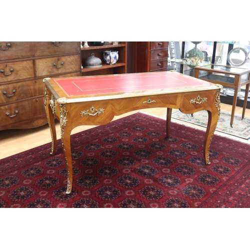 171 - French Louis XV style bureau plat, with tooled red leather writing surface, brass banded edge, and c... 