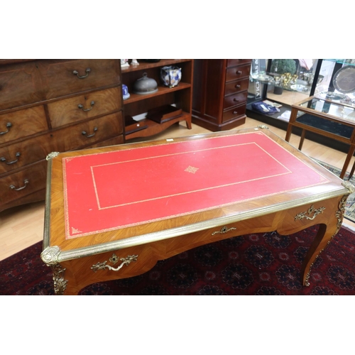 171 - French Louis XV style bureau plat, with tooled red leather writing surface, brass banded edge, and c... 