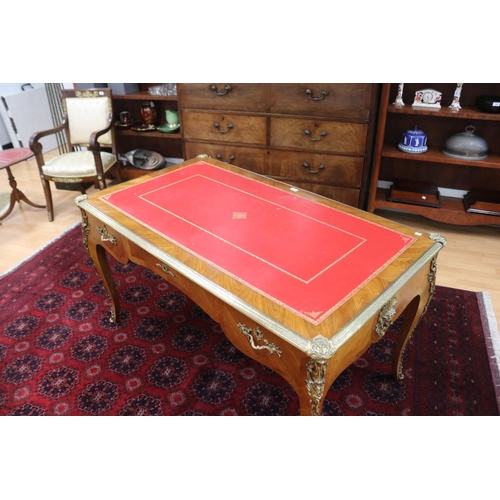 171 - French Louis XV style bureau plat, with tooled red leather writing surface, brass banded edge, and c... 