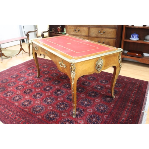 171 - French Louis XV style bureau plat, with tooled red leather writing surface, brass banded edge, and c... 