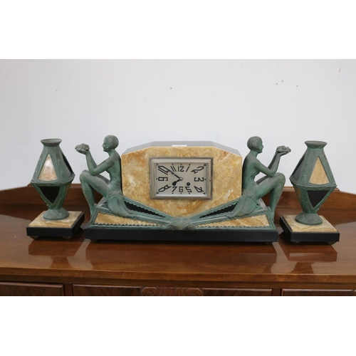 241 - French Art Deco marble and bronzed spelter mantle clock and pair of garnitures, has two keys (in off... 