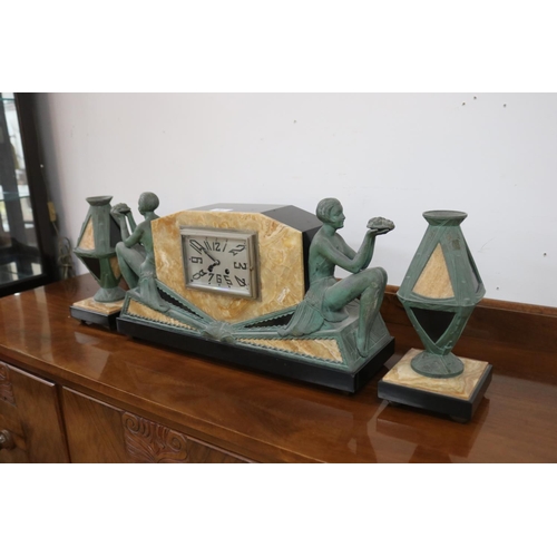 241 - French Art Deco marble and bronzed spelter mantle clock and pair of garnitures, has two keys (in off... 