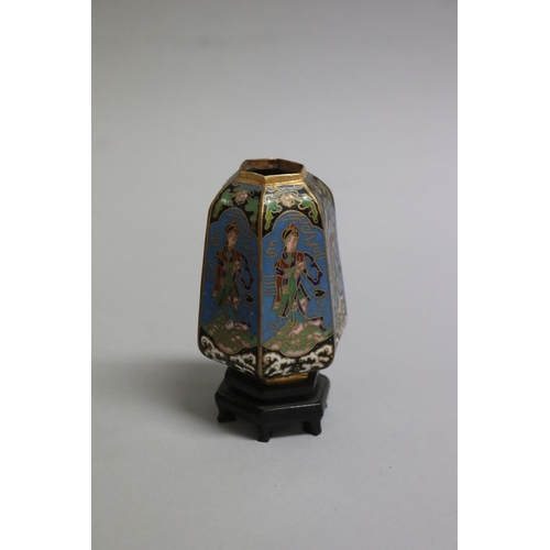 116 - Small Chinese cloisonne hexagonal vase with wooden stand along with a phoenix figure set with glass ... 