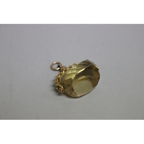 246 - 9ct gold spinning fob, set with a faceted citrine, approx total weight 15 grams