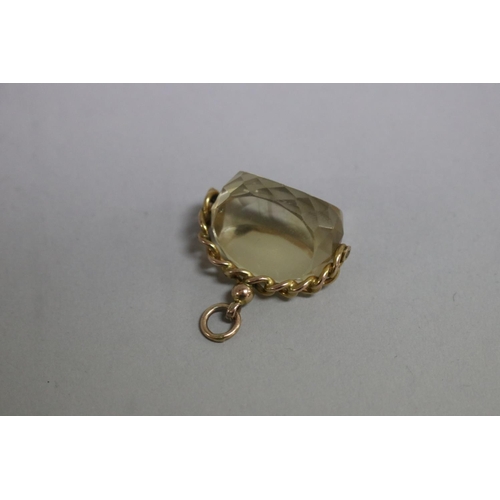 246 - 9ct gold spinning fob, set with a faceted citrine, approx total weight 15 grams