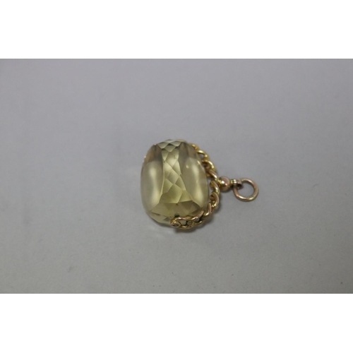 246 - 9ct gold spinning fob, set with a faceted citrine, approx total weight 15 grams