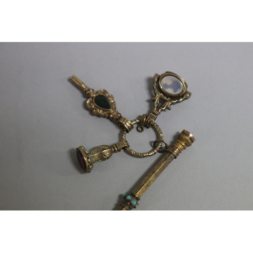 248 - Antique Victorian  miniature rolled gold and gilt chatelaine to include in retractable pencil, clock... 