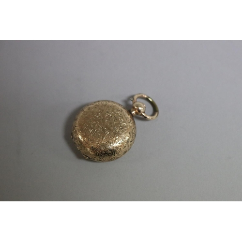 253 - Rolled 9ct gold sovereign holder, approx 3cm dia